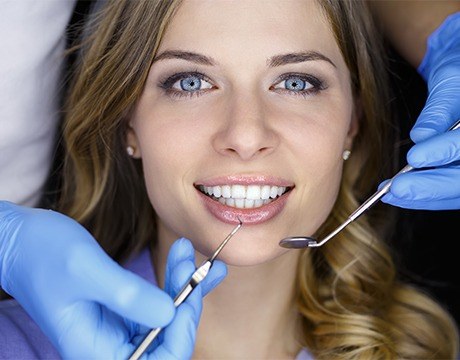 Woman receiving dental exam