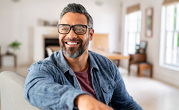 a man smiling comfortably at home