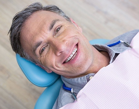 Smiling man in dental chair