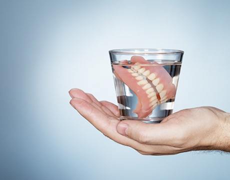 full dentures in glass of water