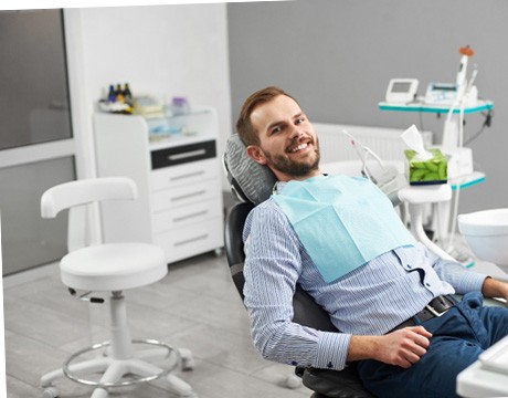 Male patient smiling after receiving dental implants in Gainesville, GA