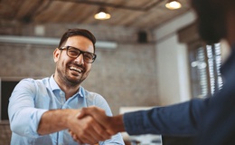 Man shaking hands with his implant dentist in Gainesville