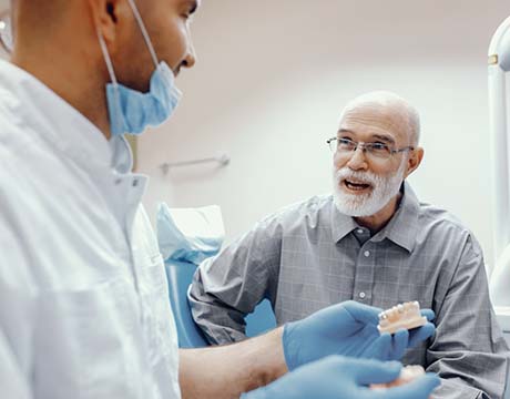 man asking his dentist questions about dental implants