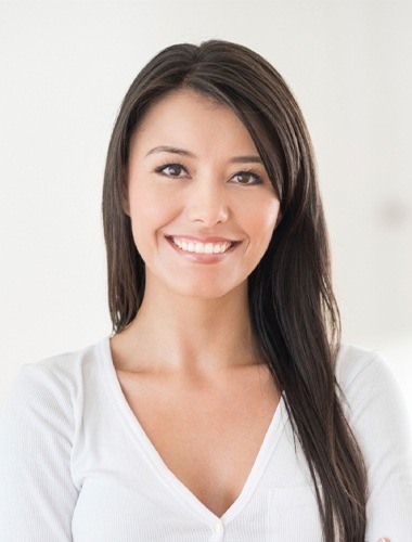 Smiling woman wearing white blouse