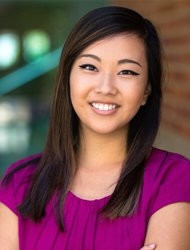 Young grinning woman with winged eyeliner