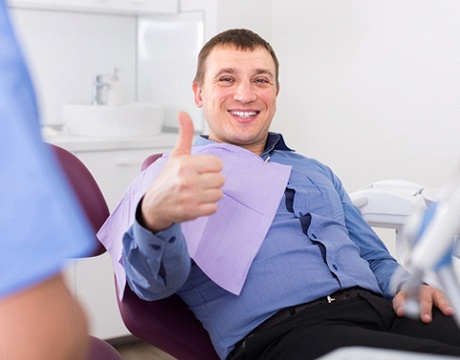 Man gives a thumbs-up to his IV sedation dentist