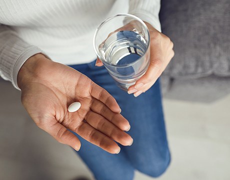 a patient taking a sedation pill