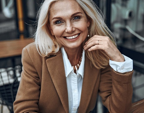 person sitting outside and smiling