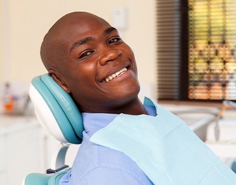 Smiling man in dental chair