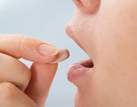 Patient taking oral sedative pill