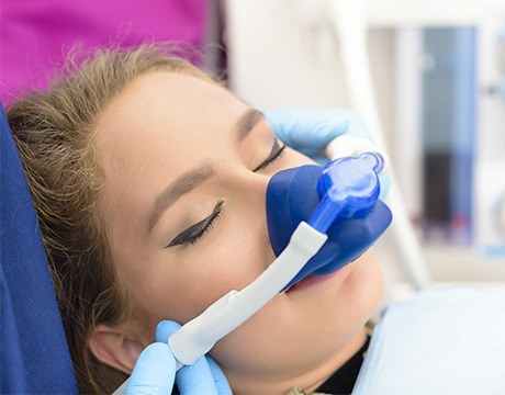 Woman with nitrous oxide nose mask