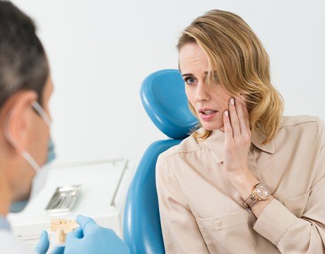 Woman holding jaw