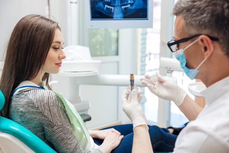 woman smiling while talking to dentist