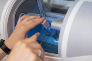 Dentist putting block of ceramic into CEREC machine